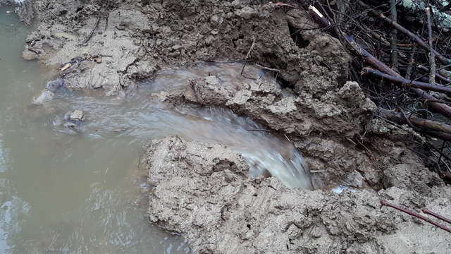 Creek overflowing culvert
