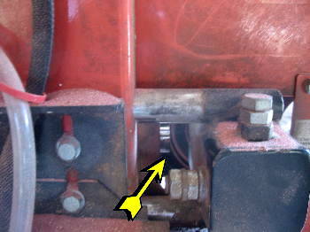 Adding oil to HD tensioner on WM mill
Here is the gap between the plunger and the wheel axle.
Keywords: Wood-Mizer