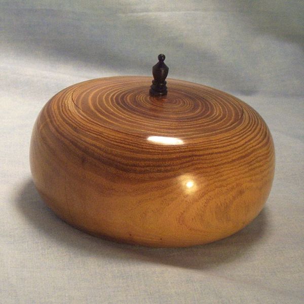 Lidded Box - Osage Orange - Feb 2011 001A
View 1 of an Osage Orange lidded box with a cocobola finial. The box is approximately 4 inches in diameter.
