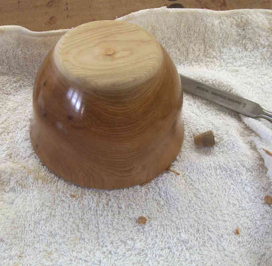 Figure 5: Tutorial â€“ Finishing the bottom of a bowl
This is one of 6 pictures used in my tutorial on how I finish turning the bottom of my bowls.  This technique can also be applied to finishing the bottoms of turned lidded boxes. The Tutorial can be found on the General Woodworking Board.
