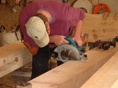 Student cutting dovetail pocket with skill saw.

