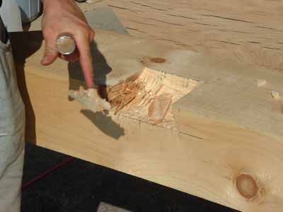 Chiseling a dovetail pocket.
