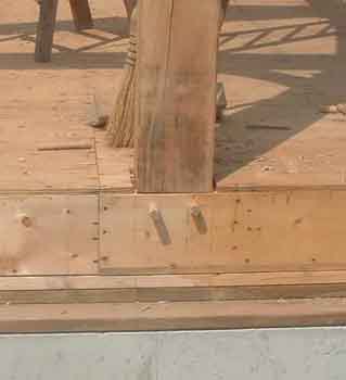 Post pegged to box/rim joist.
This picture shows a post attached to a box joist.
This box joist is on top of a mud sill with two PT sills underneath. The larger PT sill will support the sips for this frame.
