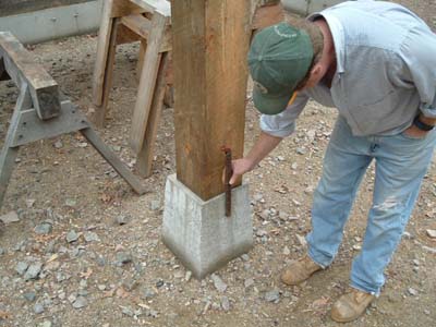 Post on Pier with rebar centering rod, and barn owner.
