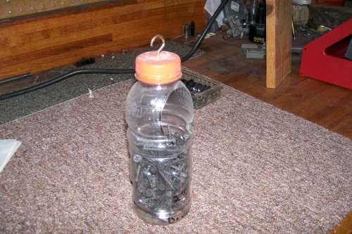 Part_container
A gatorade bottle with 2" hole cutout, and hook through the top.
