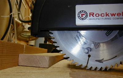 Incorrect
Incorrect beginning position of boare in relation to radial arm saw, indicating the board will be tossed in the air when the rotating blade is pushed back into it. All DanG will break loose. 
Keywords: RAS