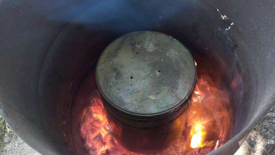 Making Charcoal
Burning good now. You could hear the vapor blowing out of the holes in the top.
