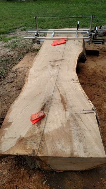 Chainsaw mill with crank and string.
