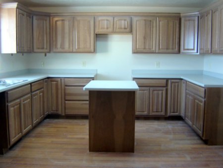Kitchen hickory cabinets (looking east) with solid-surface counter tops
