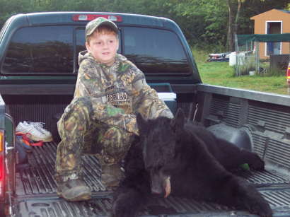 hunters 1st bear aug 2010
this is my grandson hunter,11 years old with his first bear. a sow,130 pounds. shot in lagrange maine
