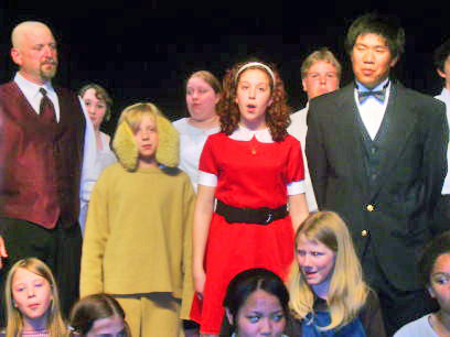 haley doing the play annie
This is my 13 year old granddaughter in the red dress.She was the star of the play annie
