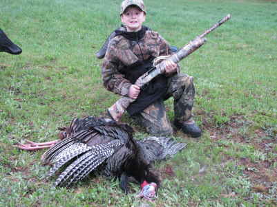 hunter 09 turkey
this is my 10 year old grandson with his first turkey,5-2-09.    9 1/2 inch beard,1 inch spurs about 20 lbs.
