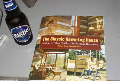 Hewn log house
Real nice book , log house 
