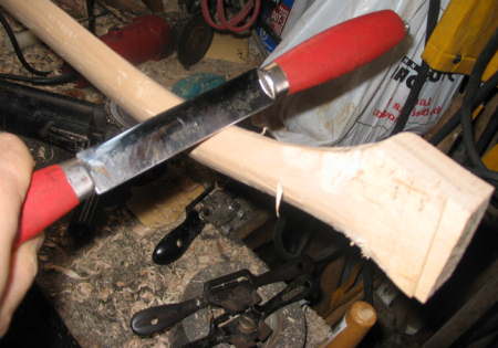 making an axe handle
Using draw knife to shape Fawn's foot 
