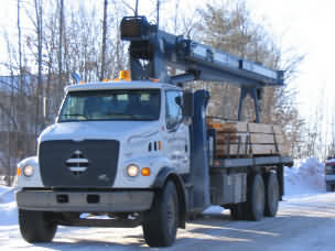 Timber frame
boom truck arriving at site 
