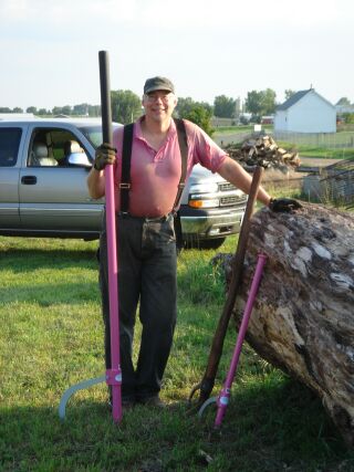 Me and my cant hooks.
That is me with my "HOT  PINK" Logrite cant hooks.  The one I am holding is a 78" super stick.  The other Pink wonder is a 36" mill special.

Thanks Logrite for making these for me!

