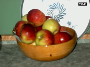 Elm wood bowl of fruit
Elm wood bowl of apples. Made from an elm tree from my grandfathers place. The tree was dying and had to be cut. I turned the bowl from some limb wood.
Keywords: elm bowl
