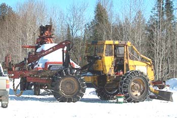 Shortwood processor and grapple mounted on skidder
