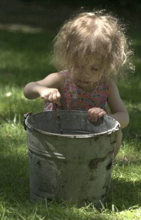 Little girl with bucket
