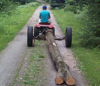Off to the mill
If the logs get bigger I link in a second garden tracter.  If they are to large for the tandom rig then the mill comes to the log.

