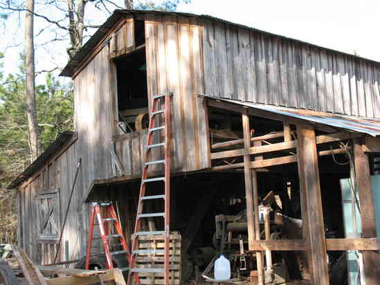 Mill extension.
Removing 1 x12" pine from west side of barn. This will cover the edger and conveyor that I am installing.
