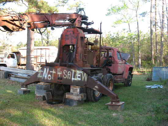 Old sugar cane loader.
Another view of the loader. I will add 4' to the frame of the rig I bought and mount a 3rd. air axle to it for stability and weight. I have a 20' flat deck I will be adding to the truck with removable log bolsters.
