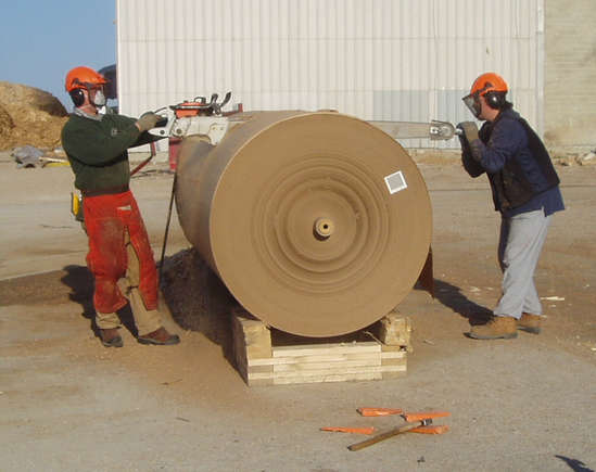 Back in 2004 cutting cull SPX paper rolls in half for local papermill to fit back into re-pulper. Toughest thing I ever cut, paper is made for cement bags. One mile of paper in each 54" diameter roll.
Stihl 090AV -60" b/c with Stihl .404 semi chisel harvester chain. We had cut up to 40 rolls in a 12 hour day at a $100 hr.
The mill has since purchased their own stationary hydraulic guiliteen valued at approx $30,000.
