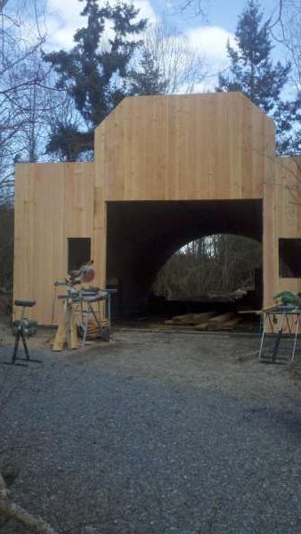 sheeting the western style store front with 1 x 10 Douglas fir board n bat

