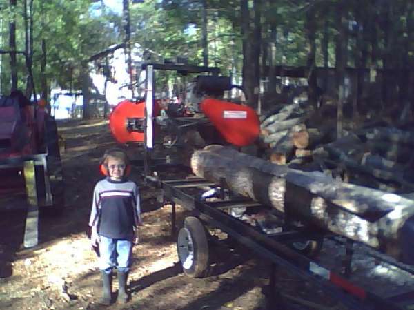 first cut
Here's my little helper proud to stand by to show off Dad's first sawmill cut.
Keywords: Turner saw mill sawmill cant tulip tree yellow poplar helper Massey Ferguson tractor loader