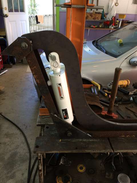 loader arm with brackets on welding table mockup
